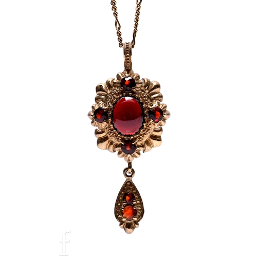83 - A 9ct gold and garnet set drop pendant, overall height including drop 4cm, on fine 9ct gold fancy li... 