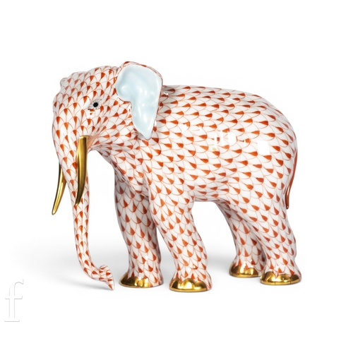 802 - Herend Pottery (Hungary), a 20th Century model of an elephant, red fishnet decoration, blue stamped ... 