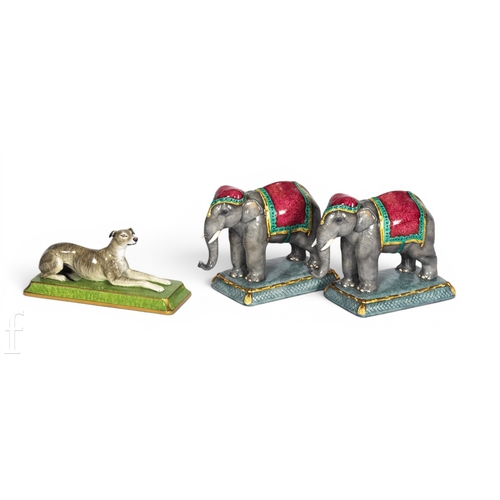 814 - A Halcyon Days bone china figure of an elephant, modelled standing on cushion base, printed marks to... 