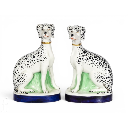 815 - A pair of Paris Porcelain (attributed) dalmatians, each modelled in sitting pose, on naturalistic ov... 