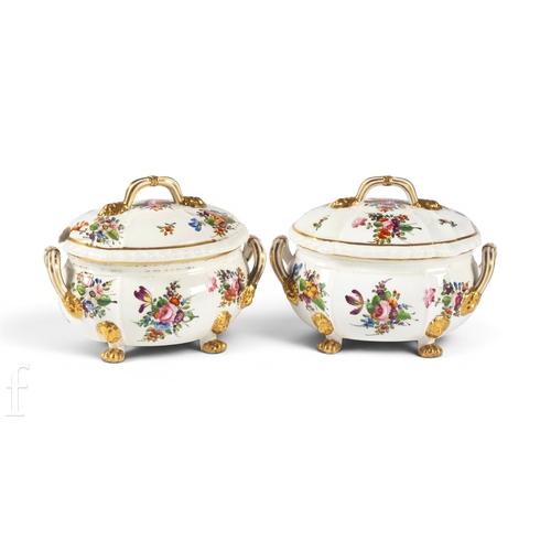 829 - A pair of early 19th Century Derby Botanical sauce tureens, of ovoid fluted form, on four paw feet, ... 
