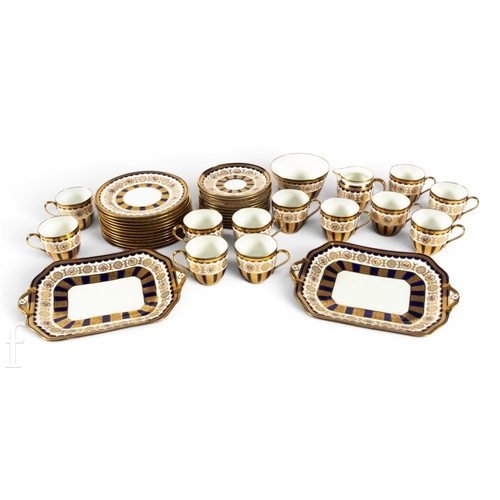 832A - A Cauldon porcelain part dinner service, pattern no.2428, acid etched foliate and blue glazed panels... 