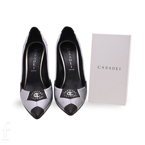 1306 - A pair of ladies Casadei high heel shoes, in silver and black leather, with silver printed logo to t... 