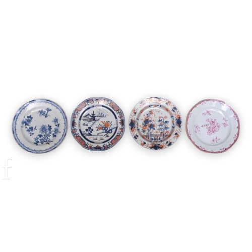 1251 - A collection of four Chinese 18th Century export porcelain plates, all of circular form, with blue a... 
