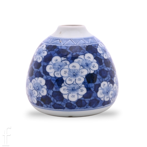 1271 - A Chinese Kangxi style blue and white blossom vase, of squat form, on a cracked ice ground, 7cm high... 