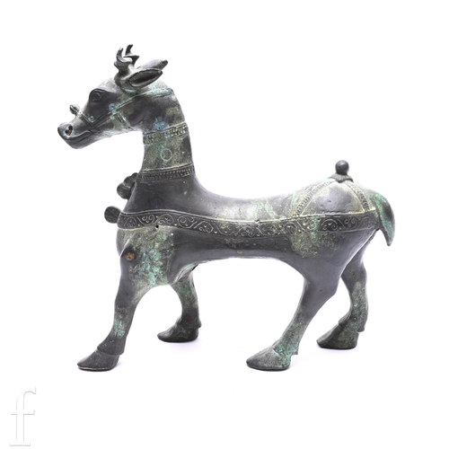 1275 - A Chinese Archaic style figure of a Qilin, cast in standing postion, unmarked, 28cm high, 29cm long.