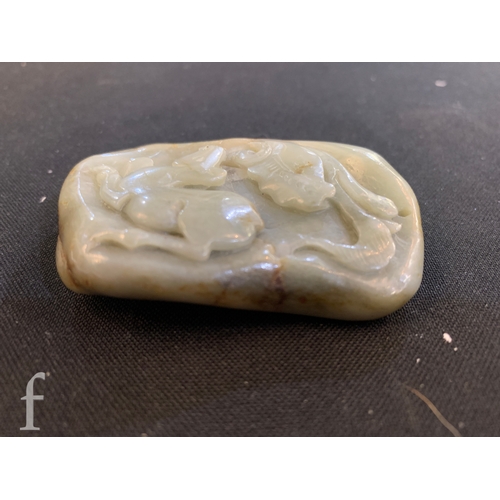 1291 - A Chinese green hardstone pebble carving of a horse under lotus flower, the polished stone carved in... 