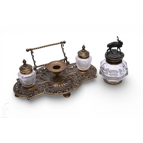 1328 - A late 19th Century cast and reticulated brass inkwell, in the manner of Bradley and Hubbard, of oge... 