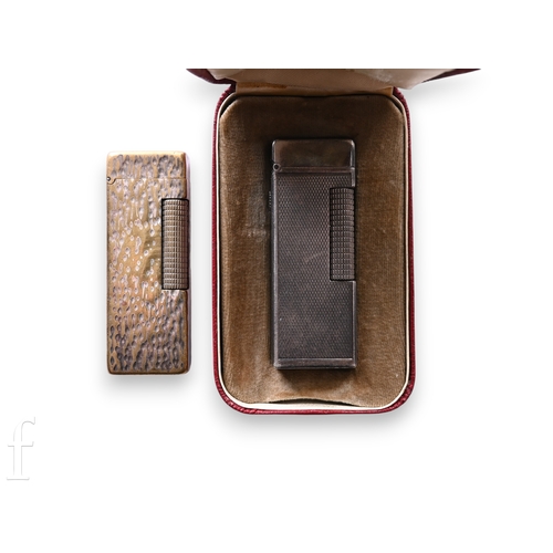 1399 - A mid 20th Century Dunhill silver plated cigarette lighter with engine-turned detail to the body, st... 