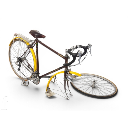 1370 - A Holdsworth five speed racing bicycle in brown and yellow, with pannier carrier.