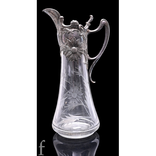 1179 - A late 19th Century Portuguese Topazio Art Nouveau style clear crystal claret jug, the footed taperi... 