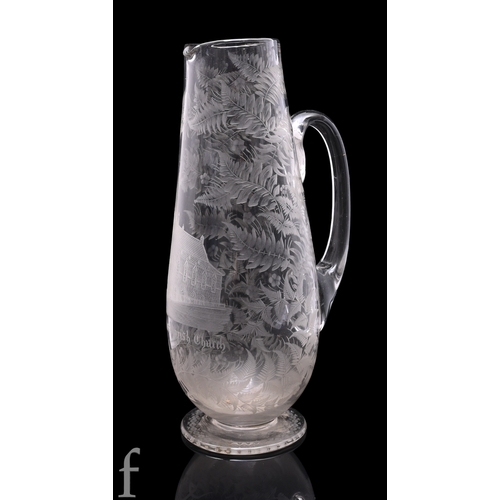 1188 - A late 19th Century clear crystal jug, the tapering ovoid body engraved with a study of Port Dundas ... 