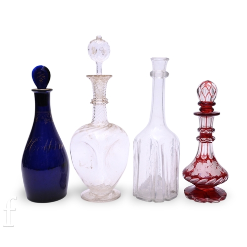 1192 - A small collection of 18th Century and later decanters to include a cruciform decanter, circa 1720, ... 