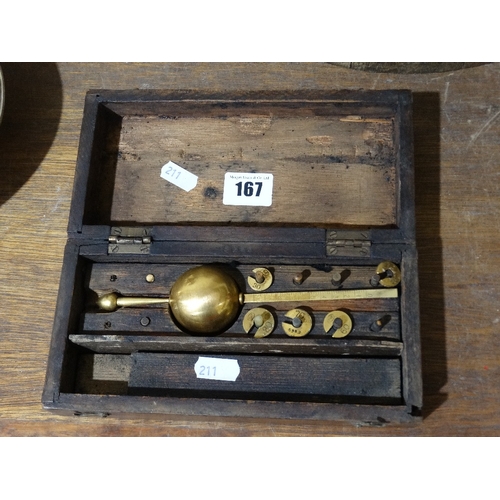 167 - A Cased Lacquered Brass Finish Weights Set