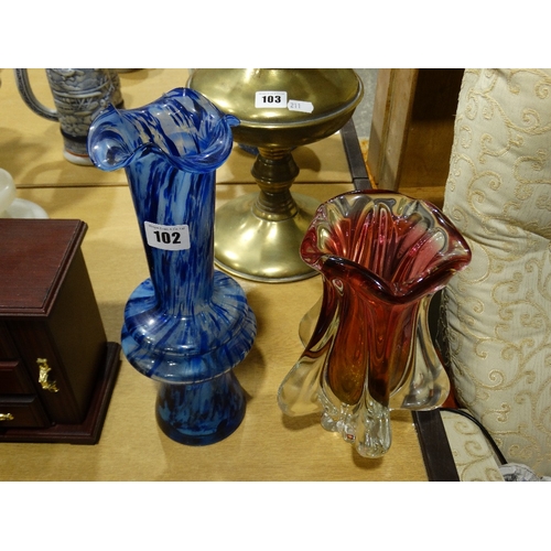 102 - A Heavy Cased Glass Vase, Together With A Blue Narrow Necked Glass Vase