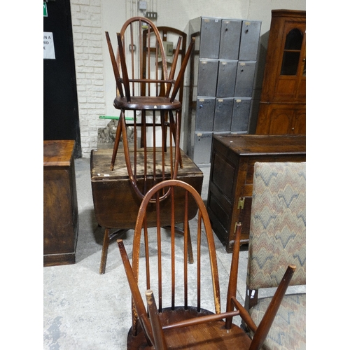 287 - An Ercol Oak Finish Dining Suite Of Drop Leaf Table & Four Spindle Back Chairs