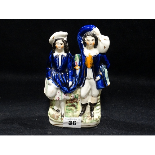 36 - A Staffordshire Pottery Group Of A Rural Couple, 7