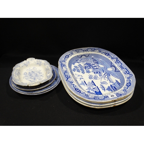 45 - Four Willow Patterned Pottery Meat Plates, Together With A Quantity Of Circular Plates