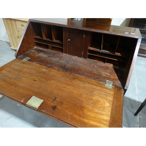 249 - A Georgian Mahogany Bureau, The Slopping Lid Revealing A Fitted Interior, The Base Having Four Long ... 