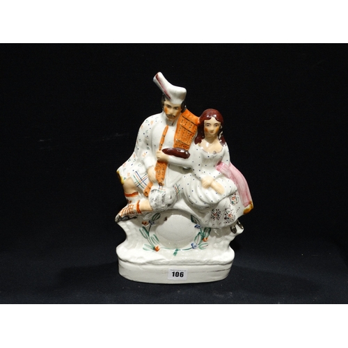 106 - A Staffordshire Pottery Scottish Figure Clock Group