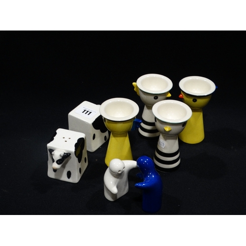 111 - A Group Of Four Novelty Chicken Egg Cups, Together With Two Novelty Condiment Sets