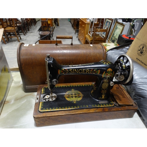 148 - A Cased Singer Sewing Machine