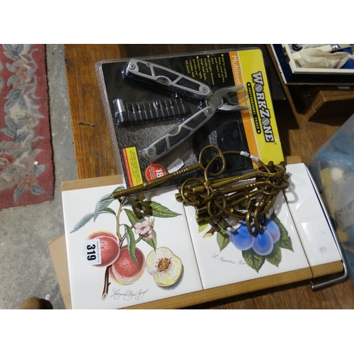 319 - A Tiled Cheese Board, Together With A Quantity Of Decorative Brass Keys Etc