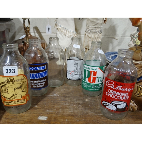 323 - Six Advertising Vintage Glass Milk Bottles