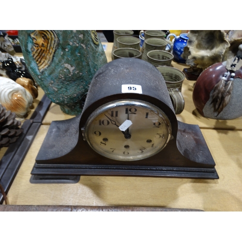 95 - An Early 20th Century Polished Mantel Clock With Circular Silvered Dial