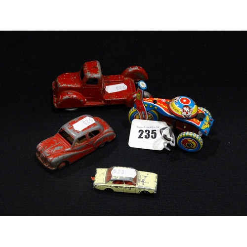 235 - A Japanese Manufacture Clockwork Trike, Together With Three Die-Cast Metal Cars