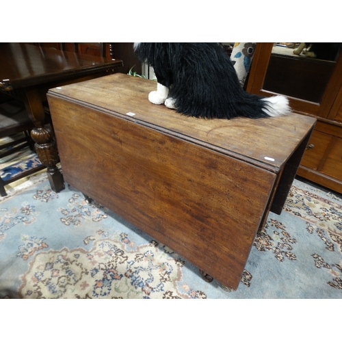 405 - A 19th Century Mahogany Drop Leaf Table On Reeded Supports