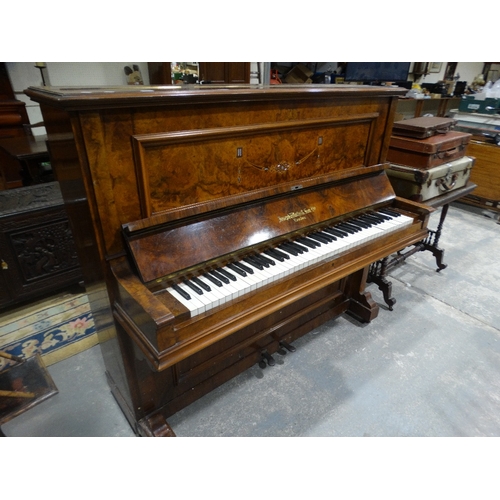 423 - A Walnut Encased Over Strung Piano By Joseph Wallis & Son Ltd, London