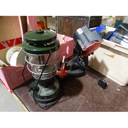 246 - A Portable Storm Lamp, Together With A Chainsaw Sharpener