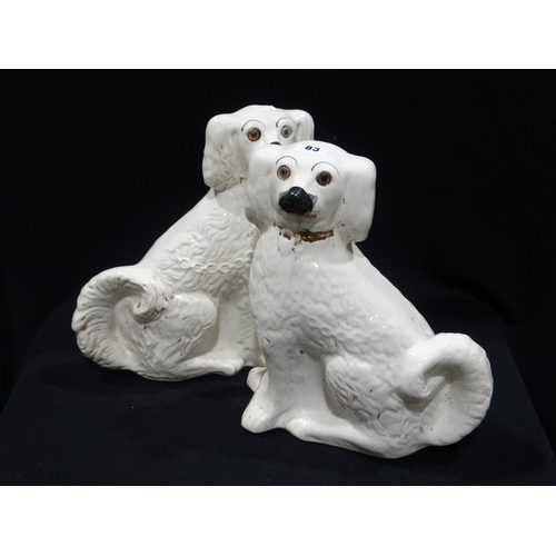 83 - A Pair Of Staffordshire Pottery White Seated Dogs