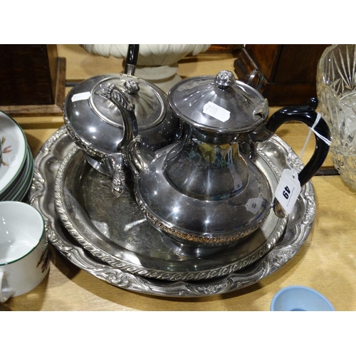 49 - A Four Piece Plated Tea Service, Together With Two Circular Trays