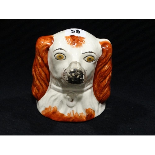 59 - A Staffordshire Pottery Spaniel Head Money Box