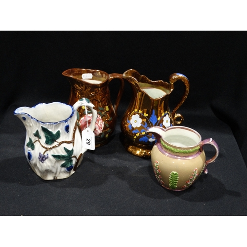 29 - Two Copper Lustre Jugs, Together With Two Staffordshire Pottery Jugs