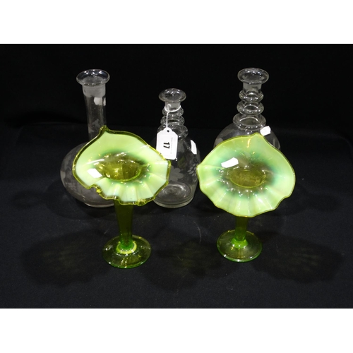 17 - A Pair Of Green Glass Vases Together With Three Decanters