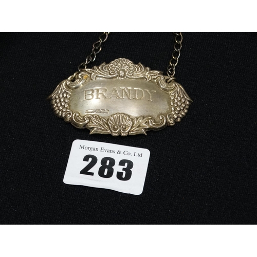 283 - A Silver Brandy Decanter Label