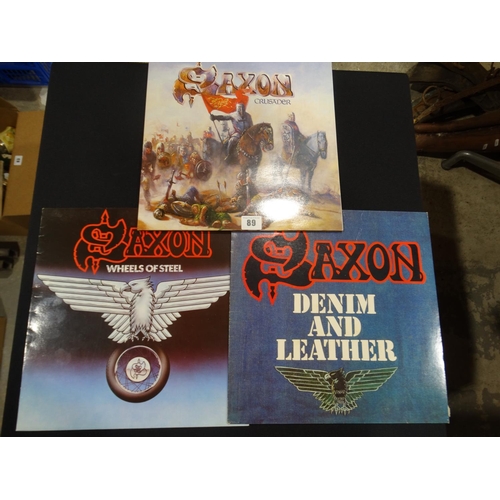 89 - Three Saxon Vinyl Records & Covers