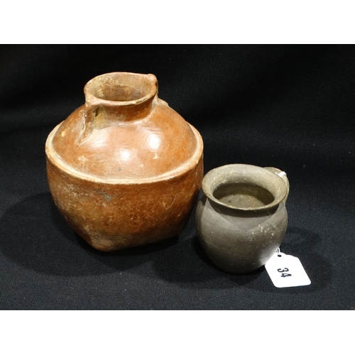 34 - An Early Squat Form Two Handled Globular Clay Pot, Together With A Smaller Single Handled Vessel