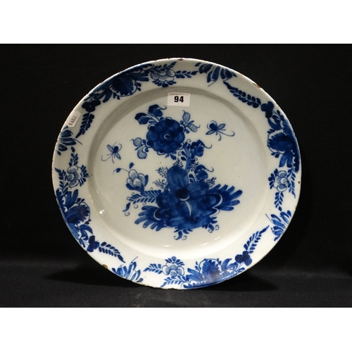 94 - An Antique Blue & White Delft Charger With Floral Centre & Border, Feather Mark To The Base, 13.5