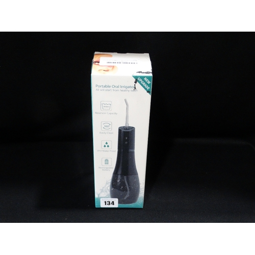 134 - A New & Boxed Portable Oral Irrigator