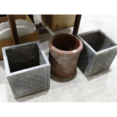 210 - A Pair Of Square Planters With A Chimney Pot