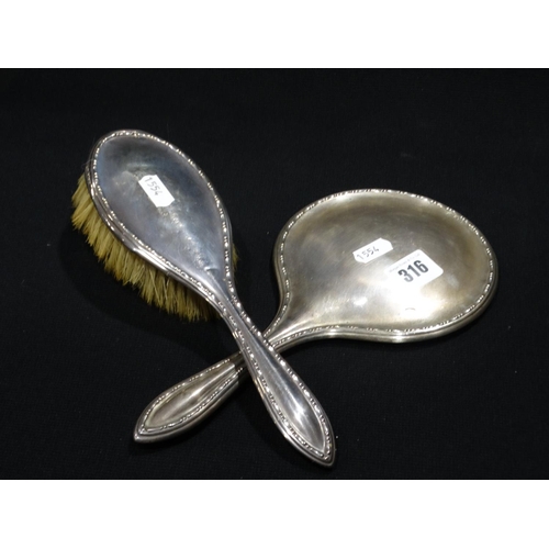 316 - A Silver Backed Dressing Table Mirror And Brush