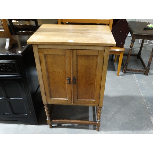 530 - A Polished Two Door Music Cabinet With A Dark Stained Dresser Base