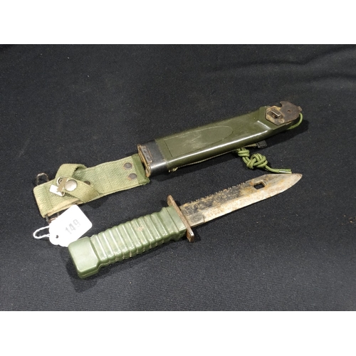 149 - A Standard Issue US Combat Knife In Plastic Sheath