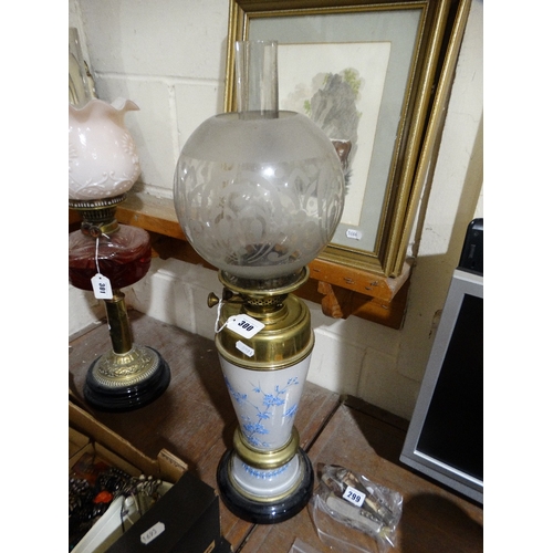 300 - A Circular Based Brass & Painted Glass Column Oil Lamp With Etched Shade