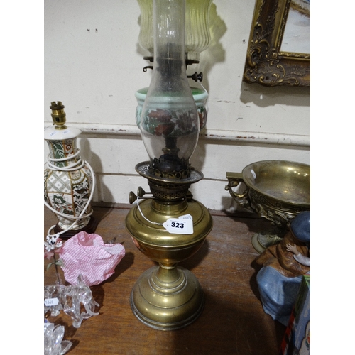 323 - A Circular Based Brass Column Oil Lamp