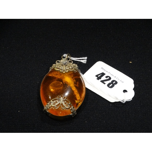 428 - An Amber Pendant With Scorpion